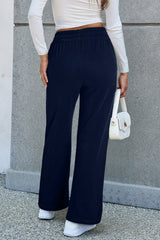 Decreeed size pants with tightening cord lined as a solid navy blue fleece