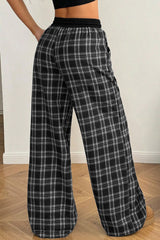 Pantalon large noir à carreaux, taille élastiquée et cordon contrasté