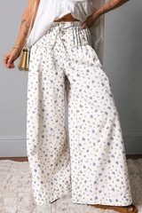Jean large blanc fleuri à taille haute, double ceinture et cordon