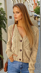 Beige textured cardigan with front pockets and pimples *