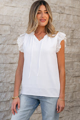White textured blouse with embroidered ruffles *