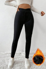 Leggings térmicos negros con cintura cruzada y piernas cosidas