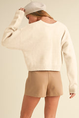 Jet stream cardigan ample knitted with butterfly knot on the front and v -neck