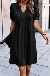 Black right t-shirt dress with notched collar and pleated puffing sleeves