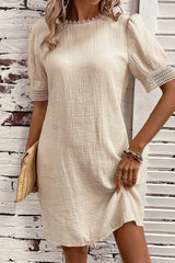 Beige right mini-drock with puffy sleeves and crumpled lace border