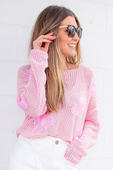Light pink drop shoulder sweater in openwork knit with large flowers
