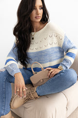 Light blue sweater with puffed sleeves and open stitch