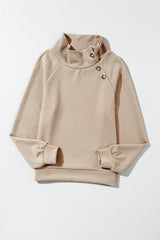 Apricot textured mock neck sweatshirt with asymmetrical buttons