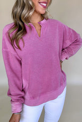 Hot pink sweatshirt with dropped shoulders and solid color notched collar
