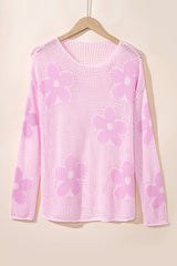 Pull rose clair en maille ajourée à grandes fleurs