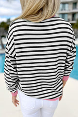 Black striped top with long sleeves and contrasting edges