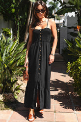 Black buttoned dress with thin and smocked suspenders on the front
