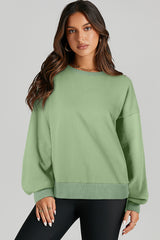 High-low drop-shoulder sweatshirt with solid fleece lining in grass green