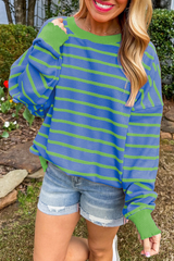 Ample sweater with sky blue stripes and round neck *