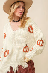 Pull ample beige en tricot torsadé avec ourlet brut et col en V