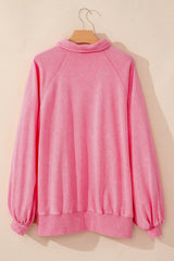 Sweat-shirt oversize rose à manches ballon et col à boutons-pression