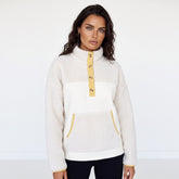 Beige fleece button-down sweatshirt with pocket and color block trim