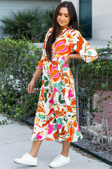 Robe longue orange à imprimé floral fendue à col en V et à plusieurs niveaux
