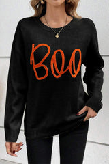 Black sweater with drooping shoulders and ribbed edges with Boo knitted pattern