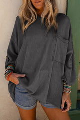 Dark grey ribbed oversized top with rolled up sleeves and chest pocket