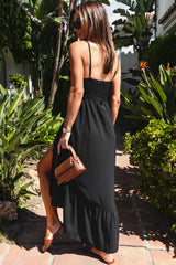 Black buttoned dress with thin and smocked suspenders on the front