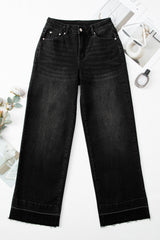 Jean ample noir à ourlet brut et poignets uniques, droit, taille haute