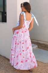 Vestido rosa largo con estampado floral y hombros anudados