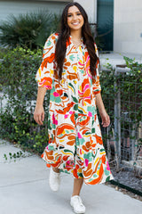 Robe longue orange à imprimé floral fendue à col en V et à plusieurs niveaux