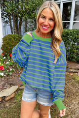 Ample sweater with sky blue stripes and round neck *