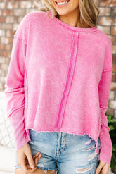 Pink sweatshirt with raw edges, exposed seams, up and down