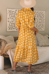 Long dress with collar and sleeve buttons bracelet and yellow flowers print