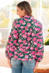 Green blouse with puffy sleeves and tied collar with floral print *