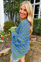 Ample sweater with sky blue stripes and round neck *