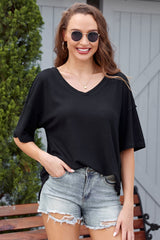Ample black in embossed knitting with drooping shoulders