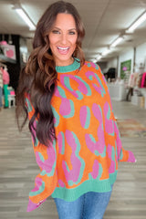 Orange leopard sweater with ribbed edges and color block