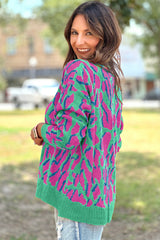 Green baggy sweater with abstract print and ribbed trim
