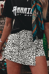 Short en jean à boutons croisés imprimé léopard noir