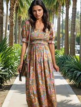 Robe florale jaune à corsage smocké *