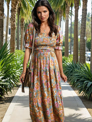 Robe florale jaune à corsage smocké *