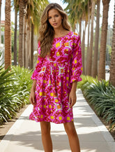 Mini-robe smockée à manches longues *