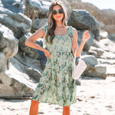 Robe courte à volants superposés et fronces à bretelles nouées et à fleurs grises