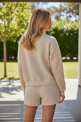 Pantalones cortos altos y acolchados con pergamino de manga larga