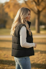 Chaleco acolchado de gran tamaño negro con cuello cuesta arriba y cremallera unida