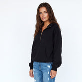 Sudadera con capucha suelta negra con bolsillos de canguro y flash de semi fermentadores forrados con vellón