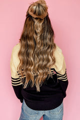 Black V-neck sweater with color block stripes