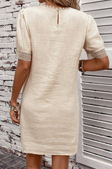 Beige right mini-drock with puffy sleeves and crumpled lace border
