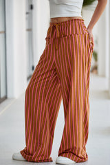 Pantalon à rayures avec poche boutonnée et taille nouée