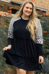 Striped black dress with ruffles and large leopard patch patch sleeves