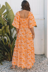 Smocked long dress with orange floral print*