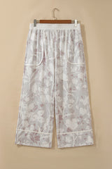 Pantalon ample gris grande taille à imprimé camouflage floral et finitions contrastées